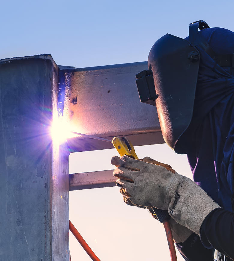 Welder connects two beams